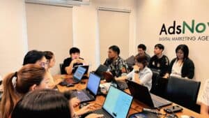 Laptop team meeting for digital marketing strategy at Pakorn.