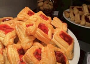 Delicious puff pastry fruit Danish pastries with strawberry jam, fresh bakery desserts, sweet treats, and baked goods from Pakorn bakery.
